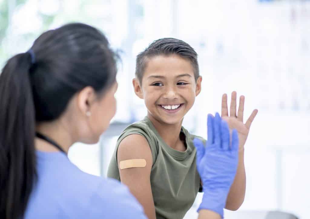 Young Boy Visits Doctor stock photo